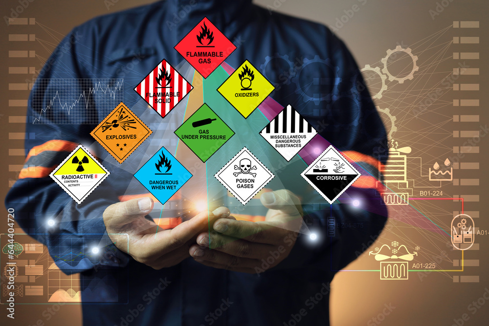 Hazardous substance concept chemical safety officer at a dangerous goods warehouse holding hologram to arrange warning sign for different chemical to separate area in sea and air cargo shipment - obrazy, fototapety, plakaty 