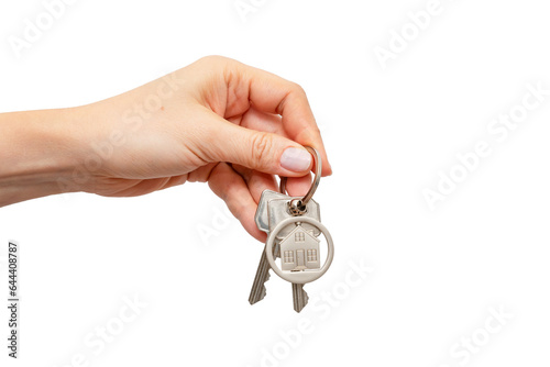 Woman holding keys with house shaped keychain