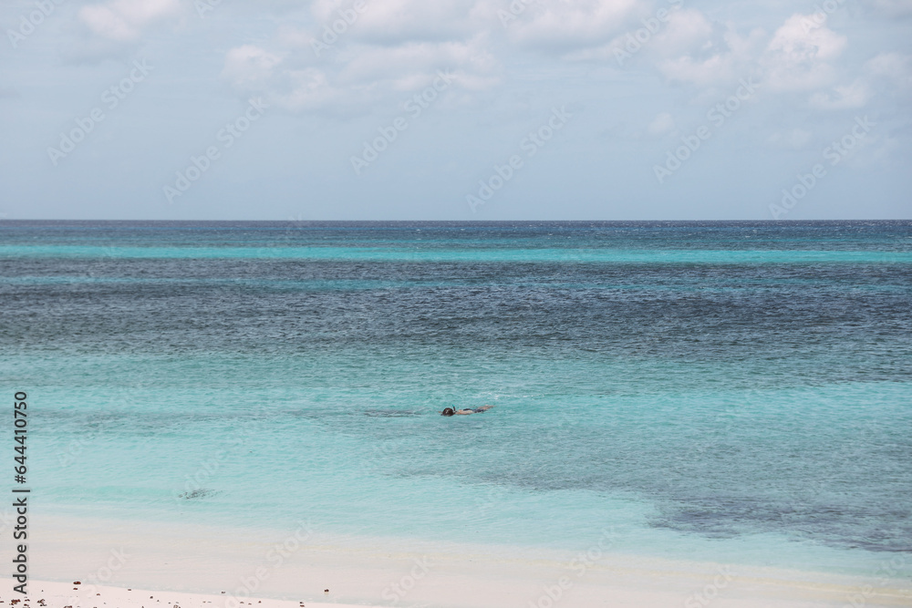 Tropical beach with blue water