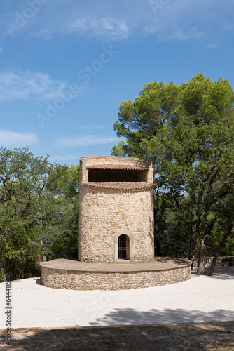 19th-century Fuveau pigeonnier: 22m stone tower, Provençal landmark. Once a windmill, now historic gem, France