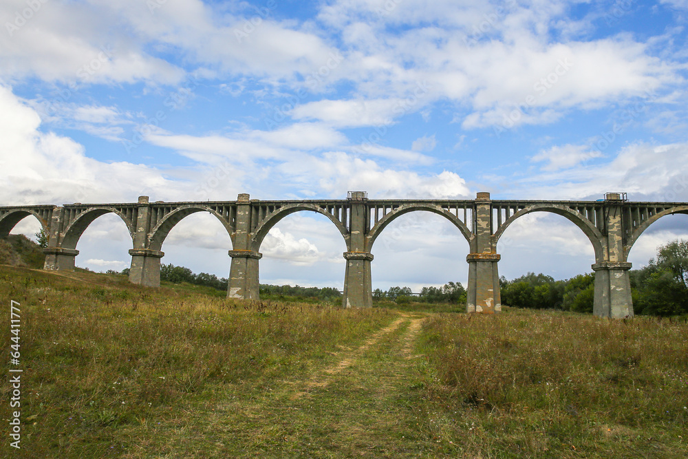 Fototapeta premium View of the abandoned old Mokrinsky railway bridge. Russia, the village of Mokry, the bridge was built in 1918