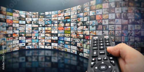 Multiple television screens with remote control photo