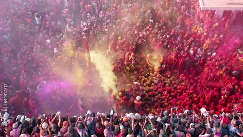 Barsana, India - 28 February 2023: Aerial view of people celebrating the holy colour festival in the street in Barsana, Uttar Pradesh, India. photo