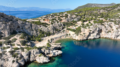 Aerial drone photo of iconic archaeological site of Heraion built by the sea forming a small secluded beach,near lake Vouliagmeni, Loutraki, Perachora, Greece