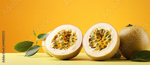 Yellow passion fruit with sweet juicy flesh and seeds isolated on a isolated pastel background Copy space photo