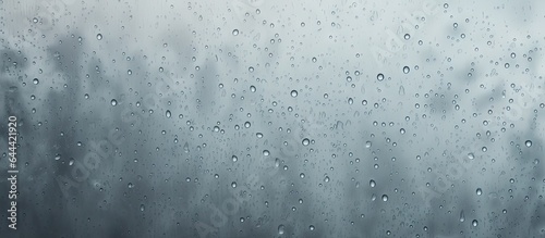Raindrops on a isolated pastel background Copy space symbolizing the rainy season