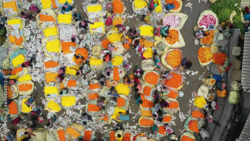 Kolkata, India - 13 May 2023: Aerial view of Mallick Ghat flower market under Howrah Bridge on the banks of the Hooghly river in Kolkata, West Bengal, India.