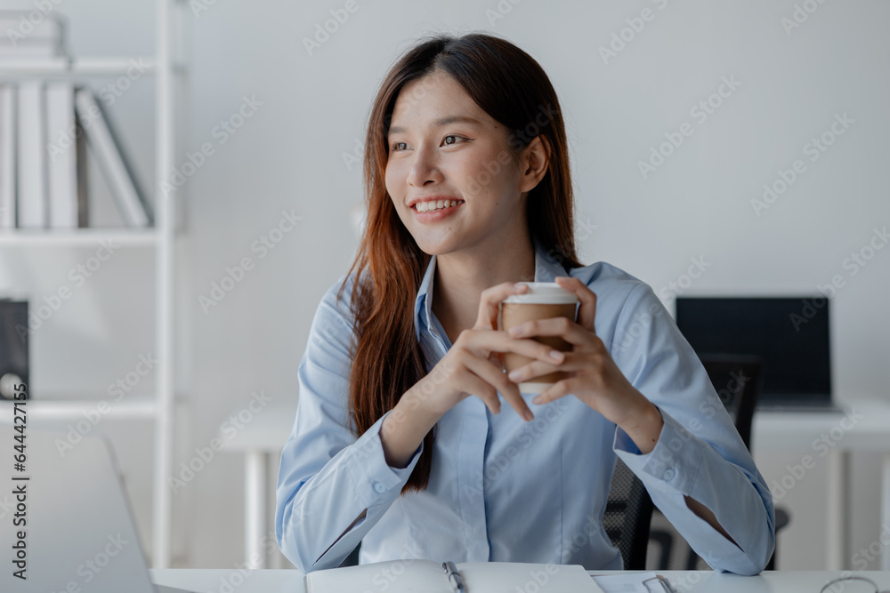 Asian woman sitting in startup company office, businesswoman, executive and investor in business and stocks, management of young people, new concept. Start-up company management concepts. Asian woman sitting in startup company office, businesswoman, executive and investor in business and stocks, management of young people, new concept. Start-up company management concepts.