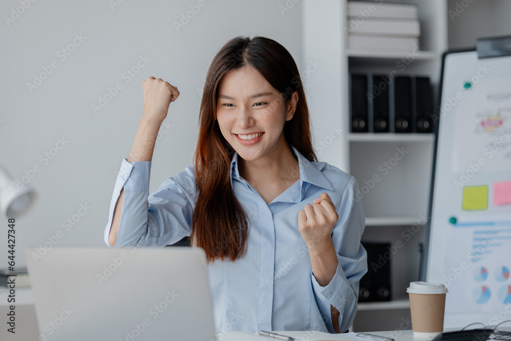 Asian woman in startup company office with happy expression, businesswoman executive and investor in business and stock, management of new generation concept. Start-up company management concepts. Asian woman in startup company office with happy expression, businesswoman executive and investor in business and stock, management of new generation concept. Start-up company management concepts.