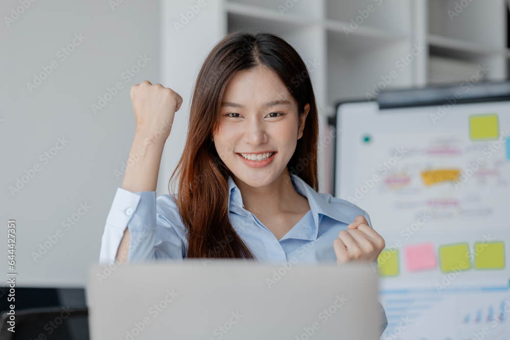 Asian woman in startup company office with happy expression, businesswoman executive and investor in business and stock, management of new generation concept. Start-up company management concepts. Asian woman in startup company office with happy expression, businesswoman executive and investor in business and stock, management of new generation concept. Start-up company management concepts.