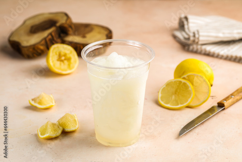 Lemon Juice lemonade with raw lime slice served in glass isolated on table top view healthy morning drink