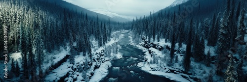 A wide-format background image for creative content, featuring a river flowing through a snow-covered forest, creating a tranquil and wintery atmosphere. Photorealistic illustration, Generative AI © DIMENSIONS