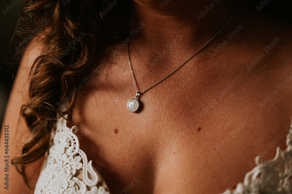 close up of a person wearing a necklace
