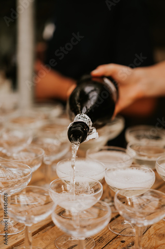 pouring champagne into glass