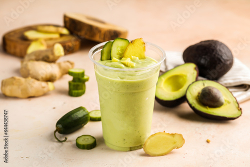 Super Green Detox juice include avocado, cucumber, ginger and mint served in glass isolated on table top view healthy weight loss morning drink