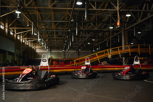 modern racing cars inside of indoor kart circuit, motor race sport vehicles, speed racing karting