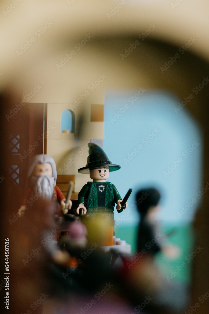 Fototapeta premium Spain - 10 Sept 2023: Harry Potter Lego, Albus Dumbledore and Minerva McGonagall figures in the Great Hall of Hogwarts. 