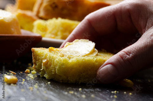 Obraz na płótnie Slices of homemade cornbread and butter on kitchen table w salonie