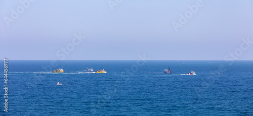 Fishing boats set out to sea to catch fish