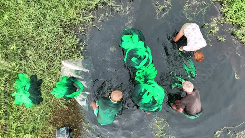 Aerial view of people washing colorful cloth for drying in Banti, Narayanganj, Bangladesh. photo