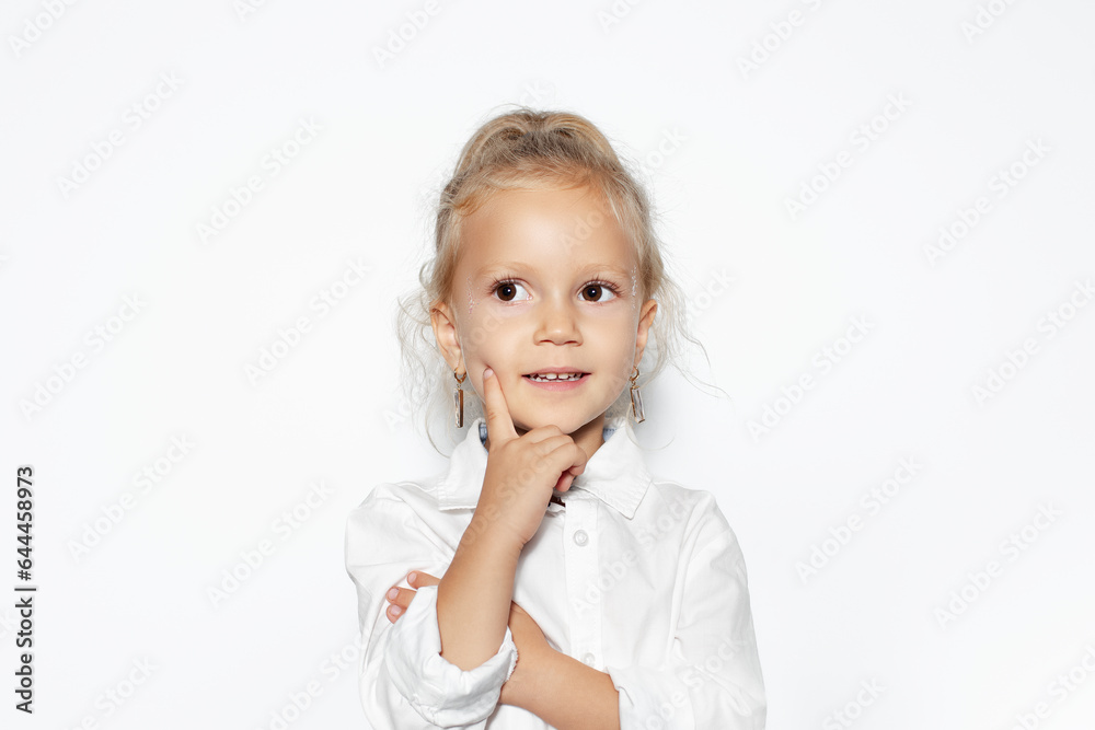 Studio portrait of smiling child girl isolated on white background. Studio portrait of smiling child girl isolated on white background.