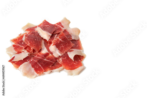 Sliced Iberian Serrano ham isolated on white background. Iberian serrano ham is a Spanish delicacy,famous for its smoky flavor and tender, salty texture, the richness of the Iberian culinary tradition