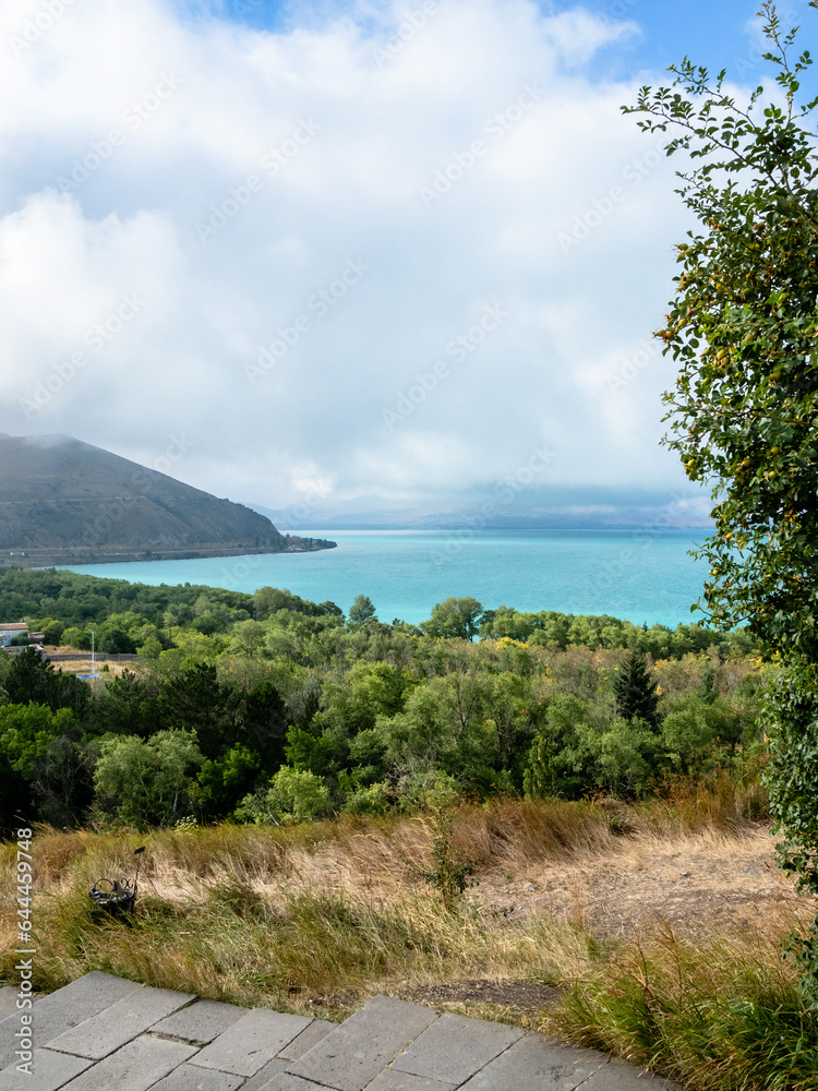 Fototapeta premium view of shore of Lake Sevan near Sevan peninsula on summer day, Armenia