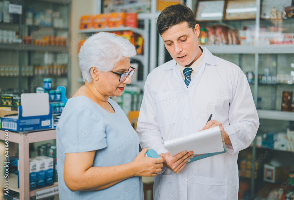 Pharmacist giving advice And advice for patients who come to buy Medicine, Drugs, Vitamins products, according to prescriptions in modern pharmacies. Pharmacist giving advice And advice for patients who come to buy Medicine, Drugs, Vitamins products, according to prescriptions in modern pharmacies.