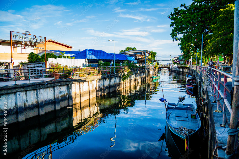 The canal drains water into the sea, on both sides of the canal there are houses of the people at Ban Na Kluea, Pattaya, Thailand.