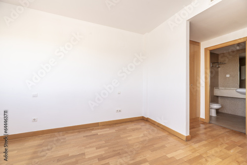 An empty bedroom with white painted walls