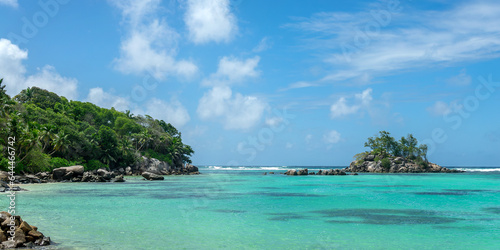 Panorama of Ile Souris, a scenic islet near Fairytale beach in Mahé island, Seychelles © Delphotostock