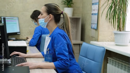 Doctor registrar talking with patient in clinic.