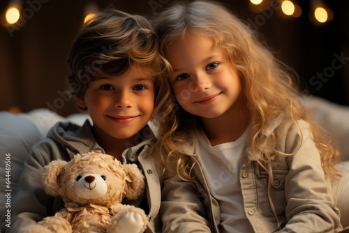 boy and girl with soft toy bear