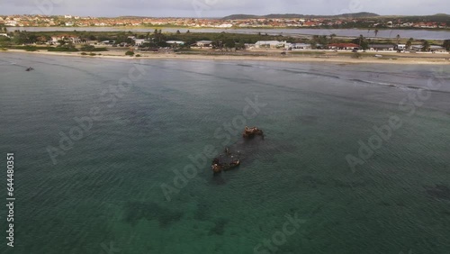Aerial view of Baboo Shipwreck along the Arashi Beach at sunset, Noord, Aruba. photo