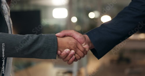 Closeup, night and business people with a handshake, cooperation and agreement for a b2b deal. Staff, teamwork and welcome with feedback, shaking hands and collaboration with partnership and support photo