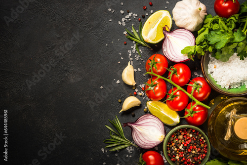 Fotografie Food cooking background on black stone table