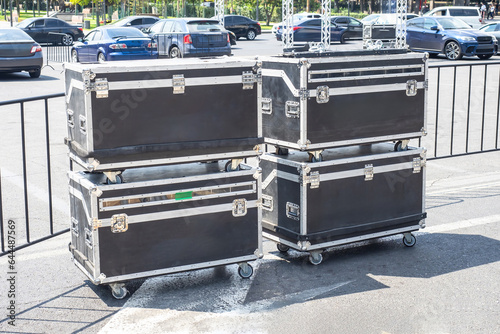 Suitcases on wheels on stre...