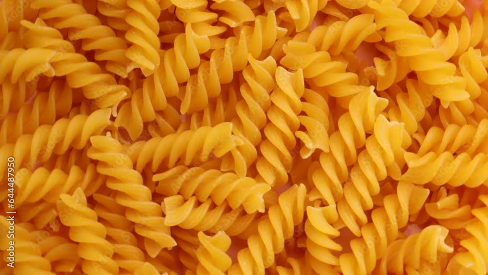 dry pasta fusilli , rotation in circle. dry spirals Turning. selective focus.
dry pasta fusilli , rotation in circle. dry spirals Turning. selective focus.