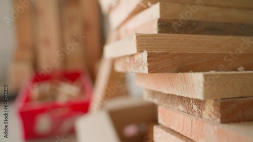 Slow motion camera through a warehouse with cut wooden planks. joinery shop photo