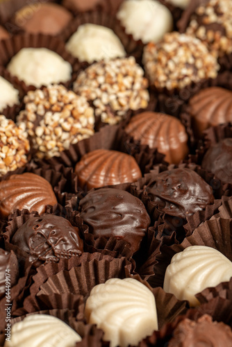 Truffle chocolate. Various chocolate pralines in bulk. close up © enezselvi