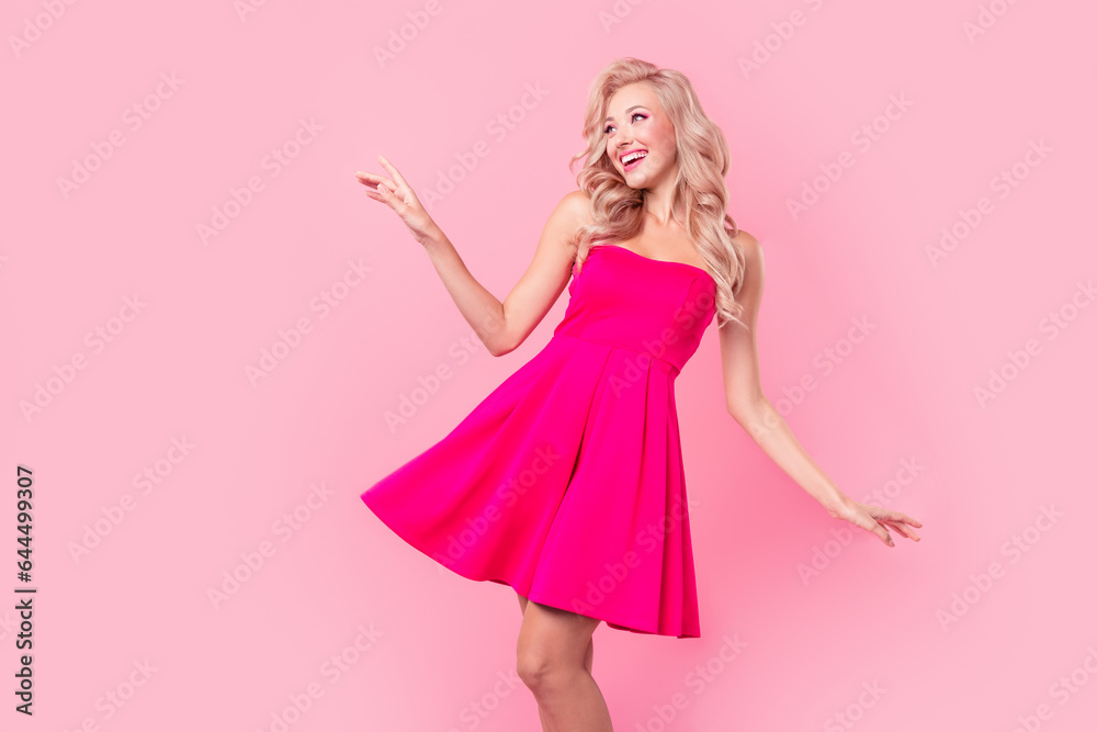 Photo of adorable carefree cheerful person dancing partying have good mood isolated on pink color background Photo of adorable carefree cheerful person dancing partying have good mood isolated on pink color background