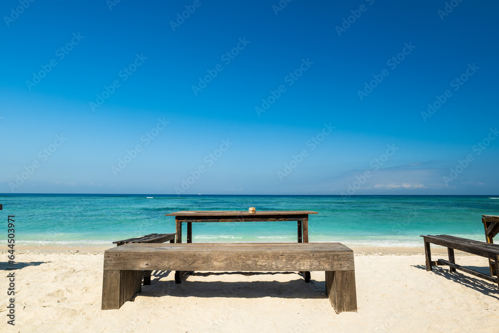 Tropical sandy beach with turquoise ocean water at Gili Trawangan, one of the Gili islands in Lombok, Indonesia