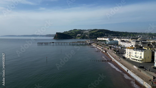 Teignmouth, South Devon, England: DRONE VIEW: Teignmouth Promenade and and seafront properties; Teignmouth Pier and the Ness escarpment (behind the pier). Teignmouth is a popular UK holiday resort.