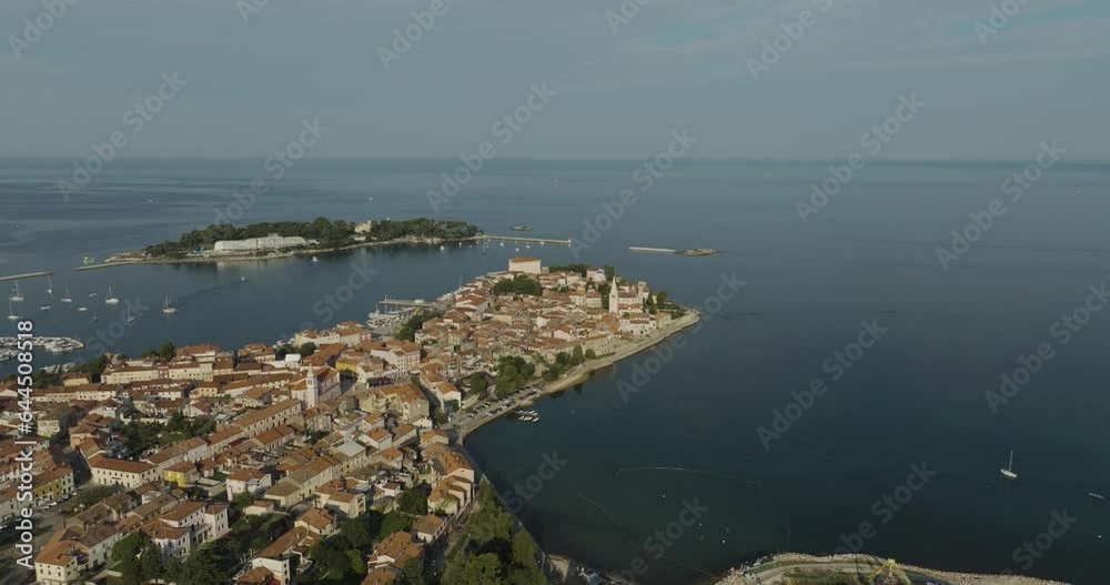 Aerial view of Porec at sunset, a small town along the Adriatic Sea coastline in Istria, Croatia. Aerial view of Porec at sunset, a small town along the Adriatic Sea coastline in Istria, Croatia.