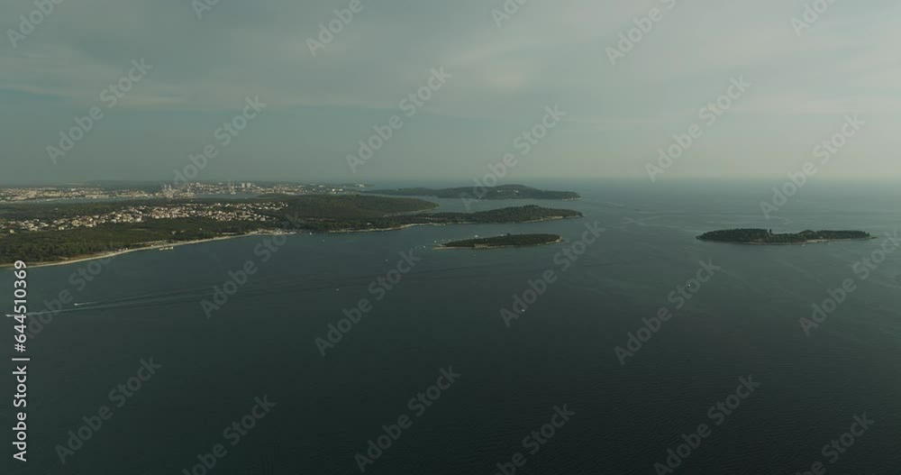 Aerial view of Brijuni National Park, a group of islands along the Adriatic Sea coastline at sunset near Pula, Istria, Croatia. Aerial view of Brijuni National Park, a group of islands along the Adriatic Sea coastline at sunset near Pula, Istria, Croatia.