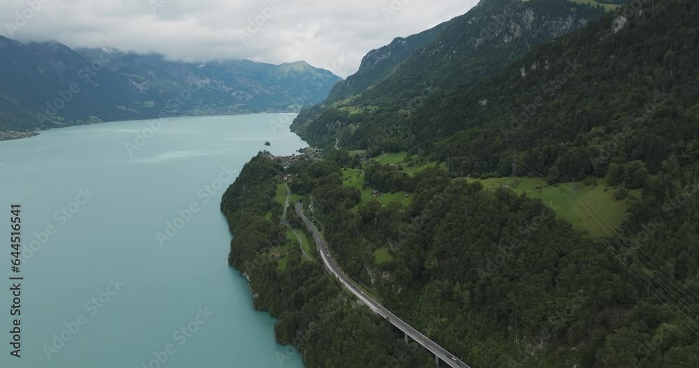Aerial view of a road following the Brienzersee Lake coastline, Bonigen, Bern, Switzerland. Aerial view of a road following the Brienzersee Lake coastline, Bonigen, Bern, Switzerland.