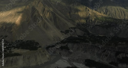 Aerial view of Karimabad and Ultar peak in the Karakoram range of the Himalayas, Hunza Valley, Gilgit Baltistan, Pakistan. photo