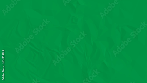 Sheet of crumpled green paper as background, top view. Sheet of color crumpled paper as background. Space for design