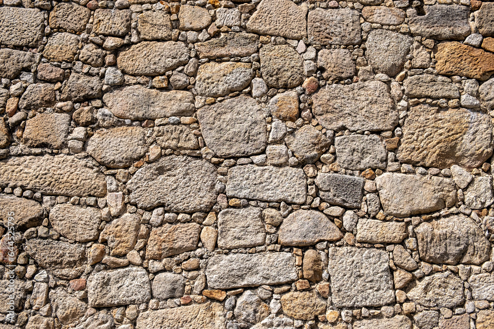 wall of irregular granite granite stones, texture for construction