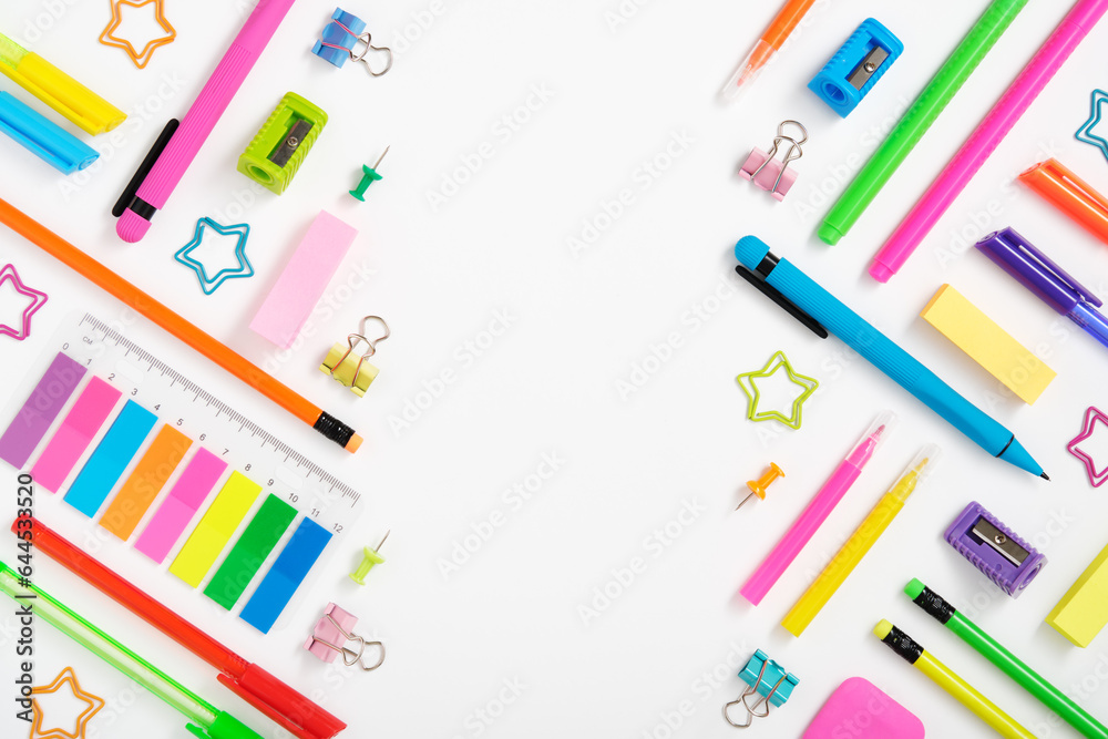 Creative layout made of neon colorful stationery set on white background. Space for your text Creative layout made of neon colorful stationery set on white background. Space for your text